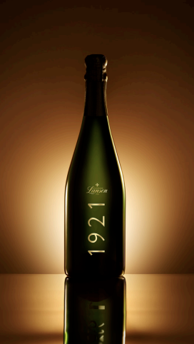 Bottle of Champagne Lanson vintage 1921, highlighted under warm light, symbolizing its historic heritage.