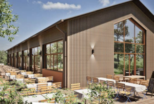 Façade en bois de La Farm dans la Montagne de Reims avec terrasse extérieure et grandes baies vitrées